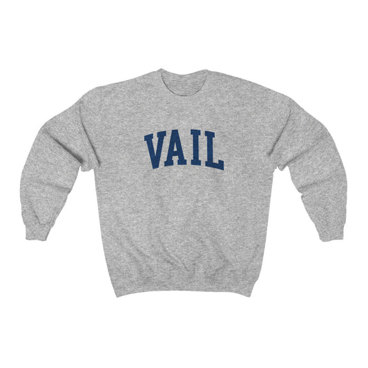 The Sport Grey Vail Colorado Varsity Crewneck Sweatshirt lays flat on a white background. The ﻿Vail Colorado Varsity﻿ graphic is in bold Navy in a Collegiate style.