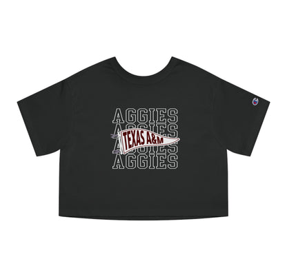 The Black Adult Womens Texas A&M Aggies Pennant Crop Top lays flat on a white background. The ﻿Texas A&M Aggies Pennant﻿ graphic is in bold White in a Varsity style.