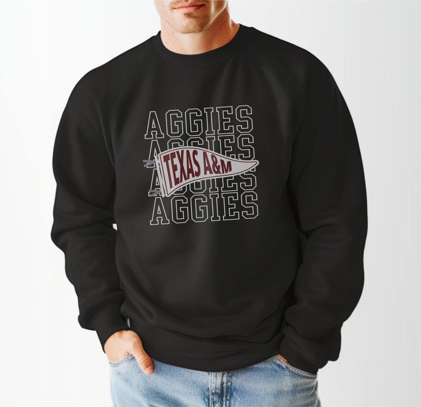 A model wears the Black Adult Unisex Texas A&M Aggies Pennant Crewneck Sweatshirt.  The ﻿Texas A&M Aggies Pennant﻿ graphic is in bold White in a Varsity style.