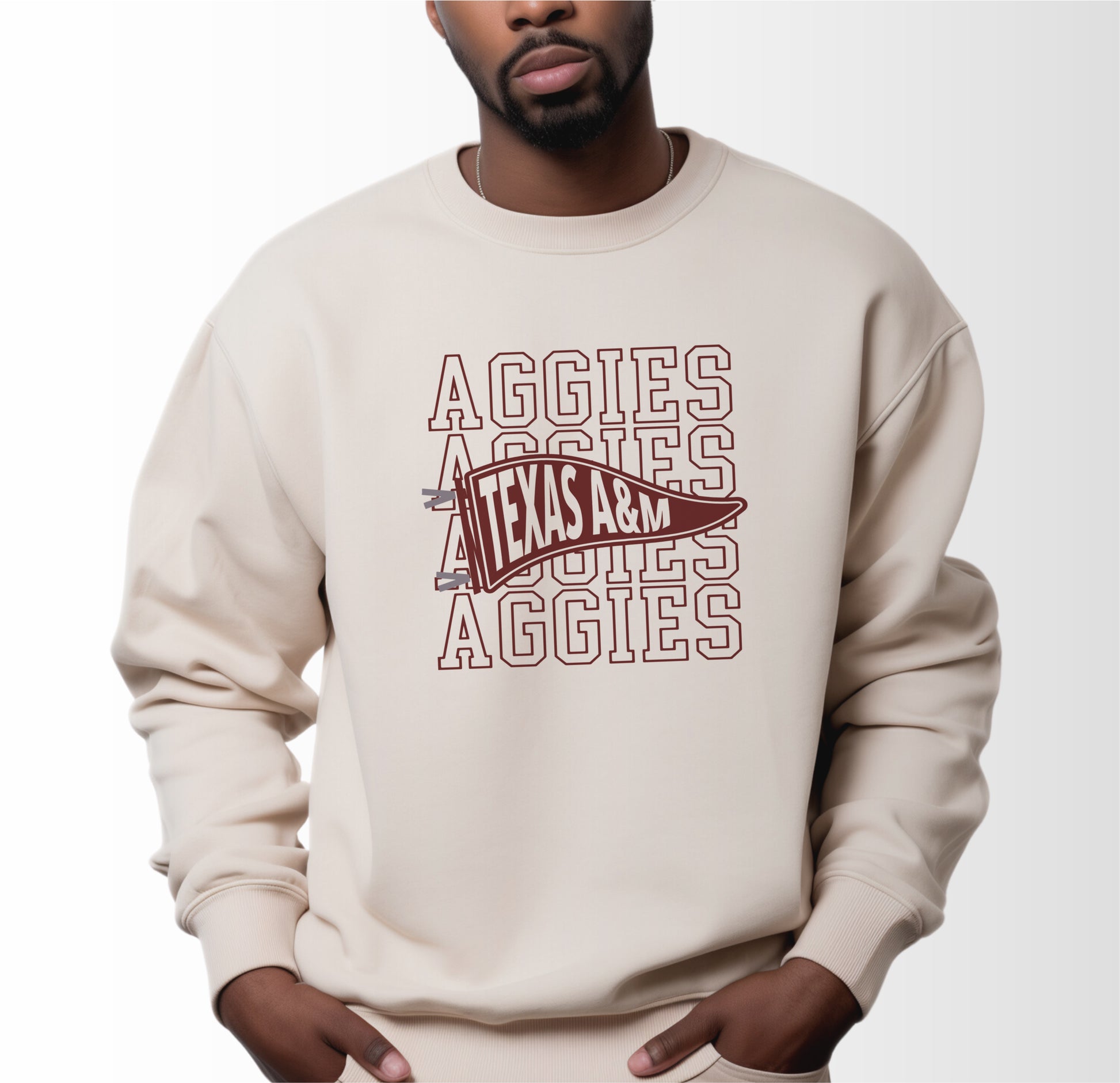 A model wears the Sand Adult Unisex Texas A&M Aggies Pennant Crewneck Sweatshirt.  The ﻿Texas A&M Aggies Pennant﻿ graphic is in bold Black in a Varsity style.