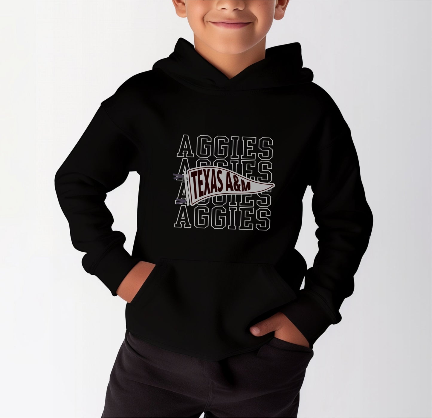 A model wears the Black Youth Unisex Texas A&M Aggies Pennant Hooded Sweatshirt.  The ﻿Texas A&M Aggies Pennant﻿ graphic is in bold White in a Varsity style.