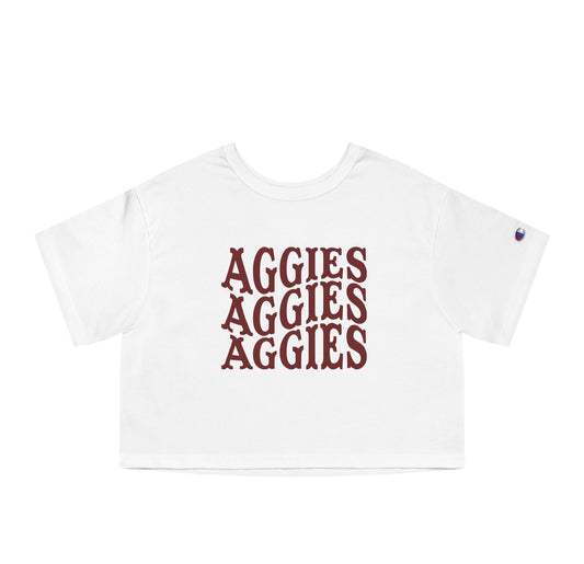 The White Adult Womens Texas A&M Aggies Aggies Aggies Western Crop Top lays flat on a white background. The ﻿Texas A&M Aggies Aggies Aggies Western﻿ graphic is in bold Maroon in a Western style.