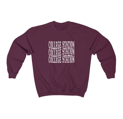 The Maroon Adult Unisex College Station Western Crewneck Sweatshirt lays flat on a white background. The ﻿College Station Western﻿ graphic is in bold White in a Western style.