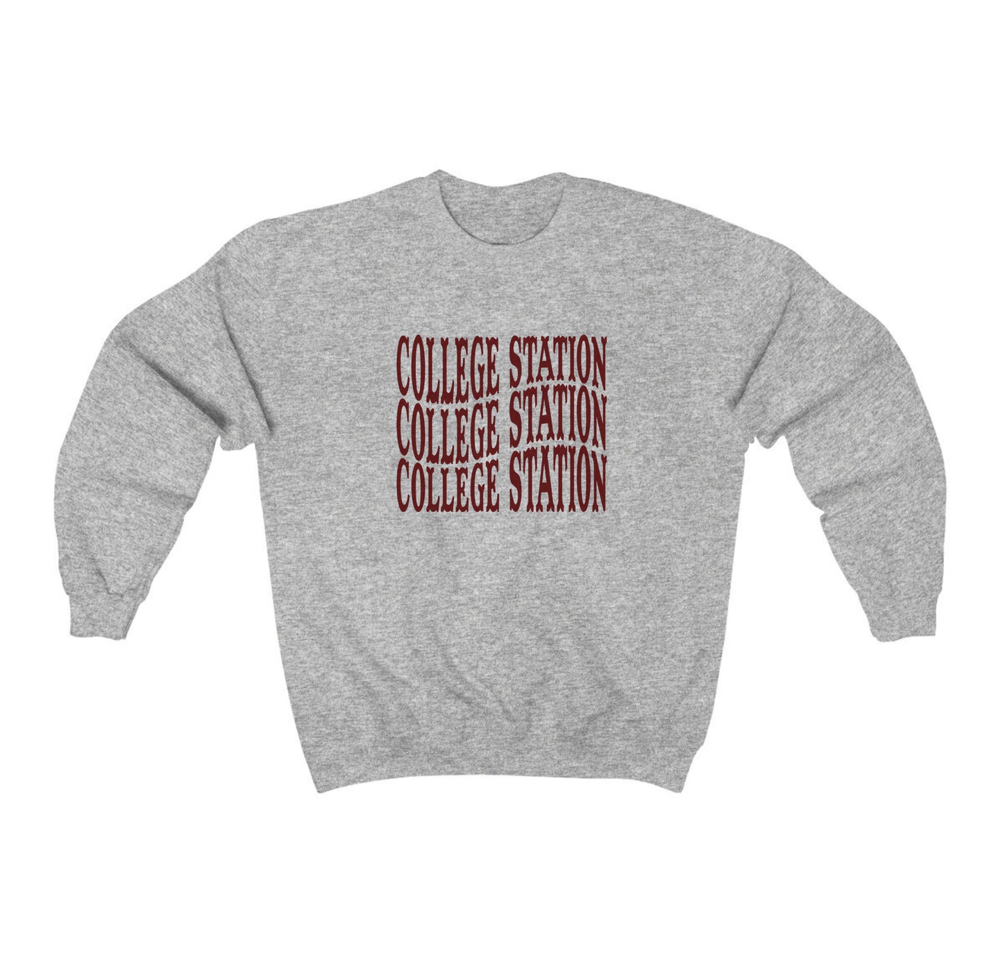 The Sport Grey Adult Unisex College Station Western Crewneck Sweatshirt lays flat on a white background. The ﻿College Station Western﻿ graphic is in bold Maroon in a Western style.