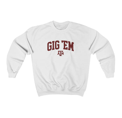 The White Adult Unisex Texas A&M Gig 'Em Collegiate Crewneck Sweatshirt lays flat on a white background. The ﻿Texas A&M Gig 'Em Collegiate﻿ graphic is in bold Maroon in a Collegiate style.