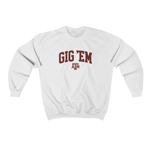 The White Adult Unisex Texas A&M Gig 'Em Collegiate Crewneck Sweatshirt lays flat on a white background. The ﻿Texas A&M Gig 'Em Collegiate﻿ graphic is in bold Maroon in a Collegiate style.