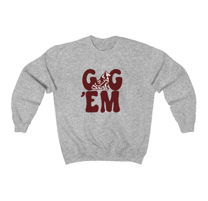 The Sport Grey Adult Unisex Texas A&M Gig 'Em Retro Reveille Crewneck Sweatshirt lays flat on a white background. The ﻿Texas A&M Gig 'Em Retro Reveille﻿ graphic is in bold Maroon in a Groovy Vintage style.