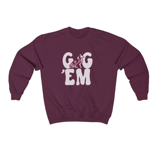 The Maroon Adult Unisex Texas A&M Gig 'Em Retro Reveille Crewneck Sweatshirt lays flat on a white background. The ﻿Texas A&M Gig 'Em Retro Reveille﻿ graphic is in bold White in a Groovy Vintage style.