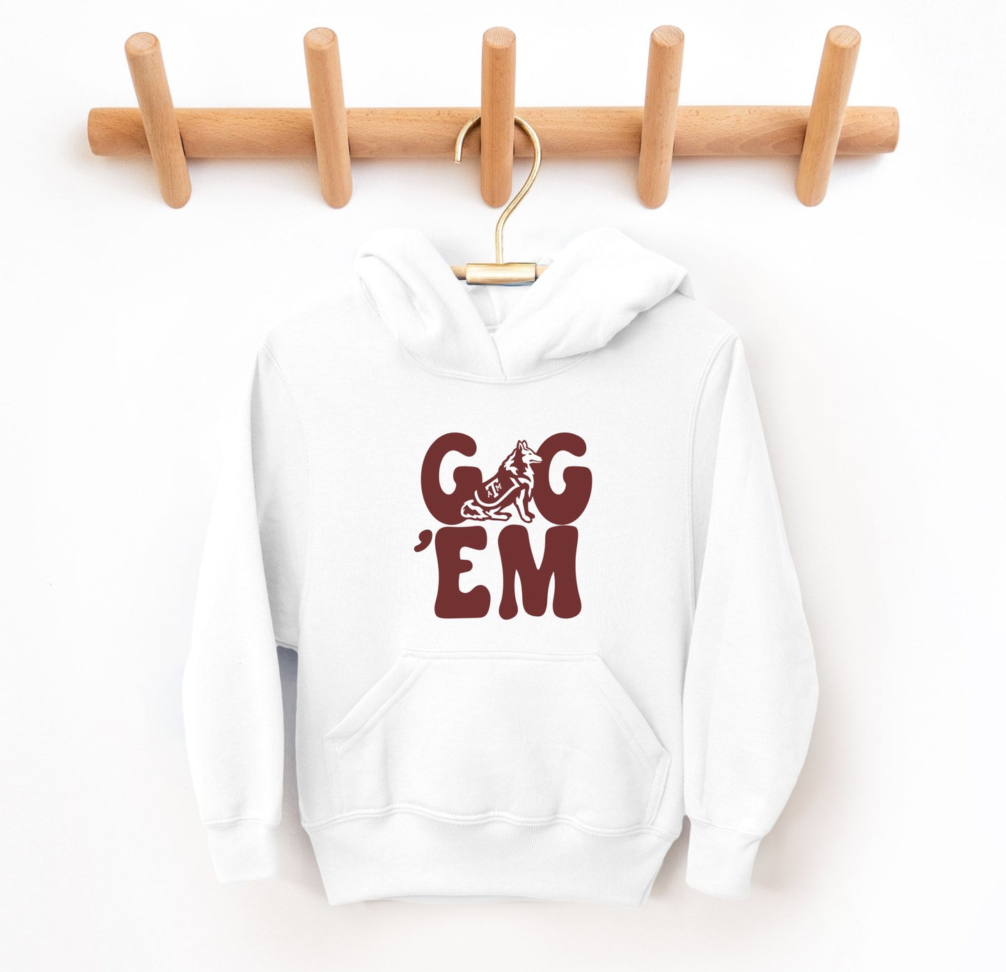 The White Infant Unisex Texas A&M Gig 'Em Retro Reveille Bodysuit lays flat on a white background. The ﻿Texas A&M Gig 'Em Retro Reveille﻿ graphic is in bold Maroon in a Groovy Vintage style.