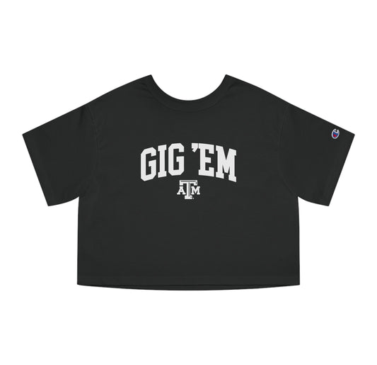 The Black Adult Womens Texas A&M Gig 'Em Collegiate Crop Top lays flat on a white background. The ﻿Texas A&M Gig 'Em Collegiate﻿ graphic is in bold White in a Collegiate style.