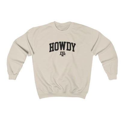 The Sand Adult Unisex Texas A&M Howdy Varsity Crewneck Sweatshirt lays flat on a white background. The ﻿Texas A&M Howdy Varsity﻿ graphic is in bold Black in a Collegiate style.