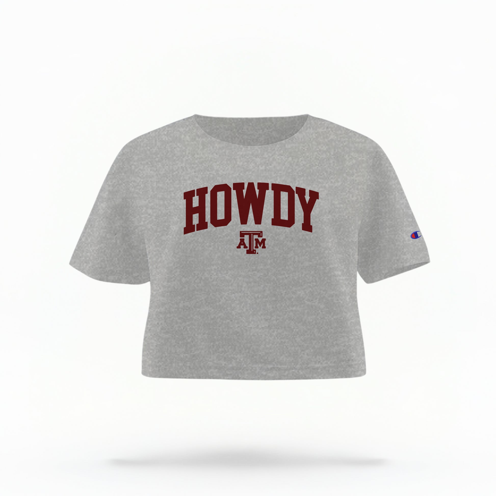 The Oxford Grey Adult Womens Texas A&M Howdy Varsity Crop Top lays flat on a white background. The ﻿Texas A&M Howdy Varsity﻿ graphic is in bold Maroon in a Collegiate style.