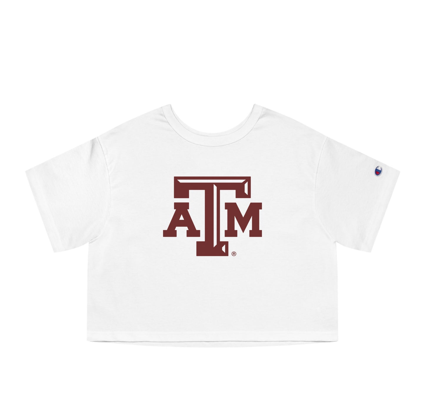 The White Adult Womens Texas A&M Logo Crop Top lays flat on a white background. The ﻿Texas A&M Logo﻿ graphic is in bold Maroon in a Varsity style.