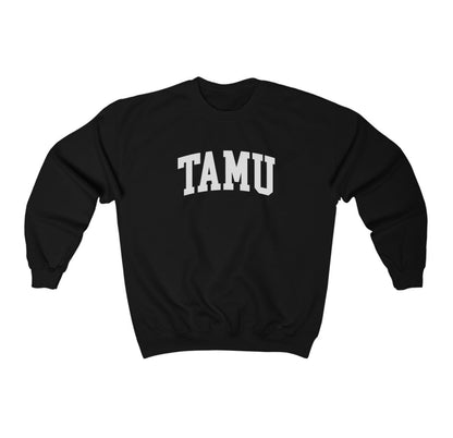 The Black Adult Unisex Texas A&M TAMU Crewneck Sweatshirt lays flat on a white background. The ﻿Texas A&M TAMU﻿ graphic is in bold White in a Collegiate style.