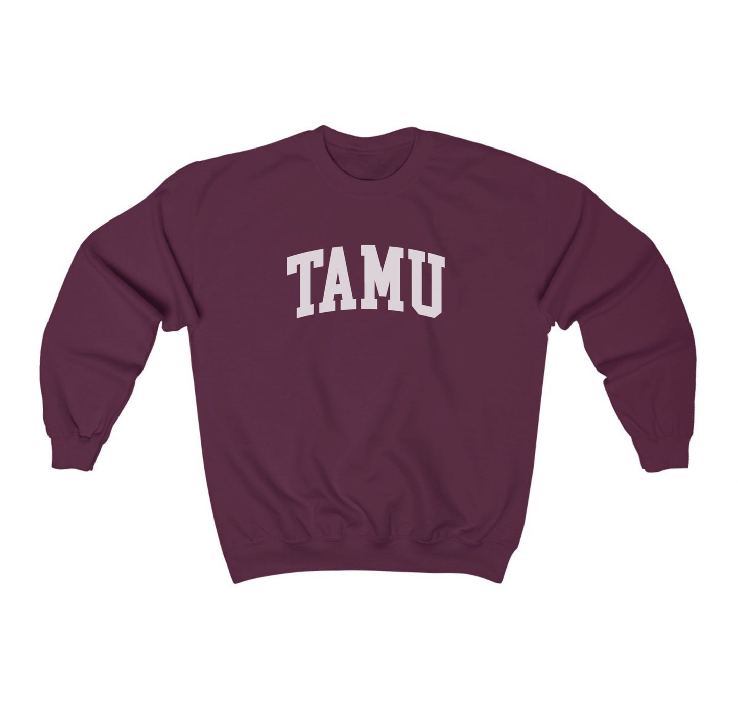 The Maroon Adult Unisex Texas A&M TAMU Crewneck Sweatshirt lays flat on a white background. The ﻿Texas A&M TAMU﻿ graphic is in bold White in a Collegiate style.