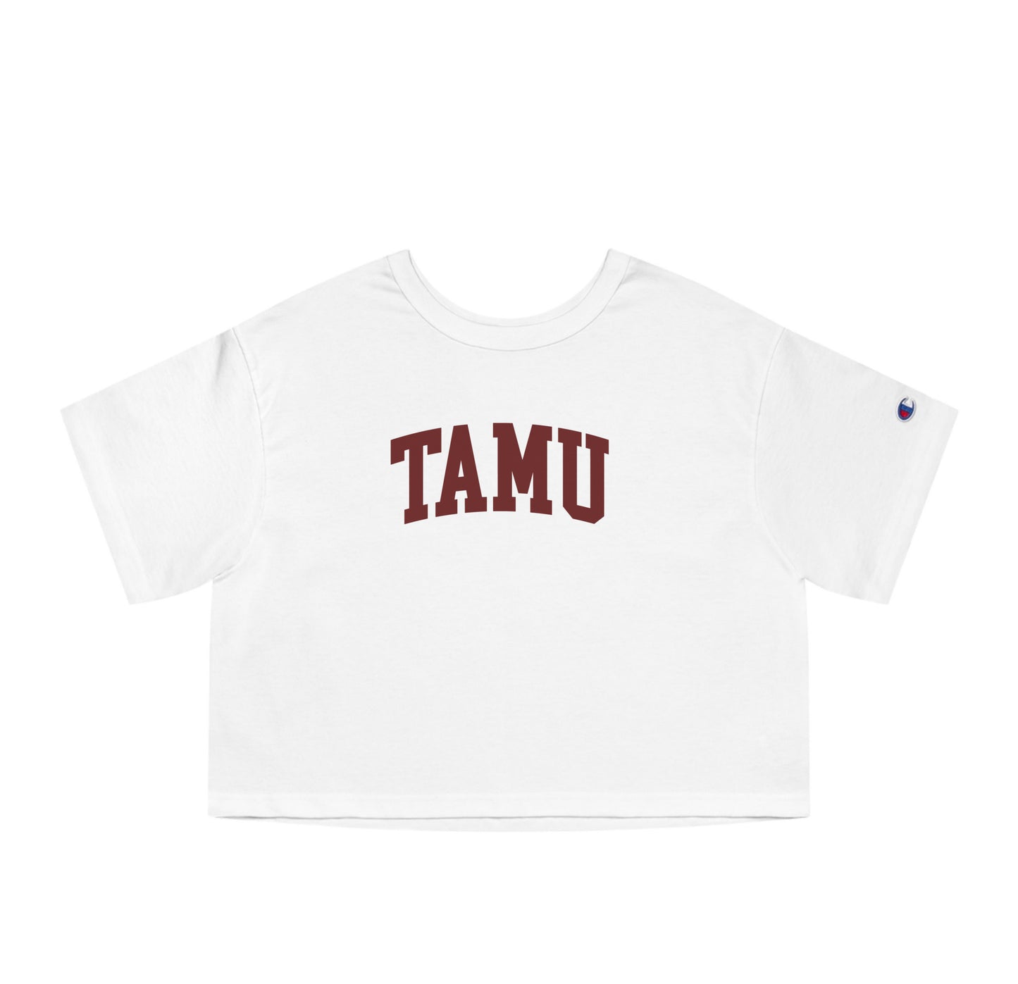 The White Adult Womens Texas A&M TAMU Crop Top lays flat on a white background. The ﻿Texas A&M TAMU﻿ graphic is in bold Maroon in a Collegiate style.