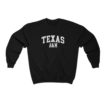 The Black Adult Unisex Texas A&M Varsity Crewneck Sweatshirt lays flat on a white background. The ﻿Texas A&M Varsity﻿ graphic is in bold White in a Collegiate style.