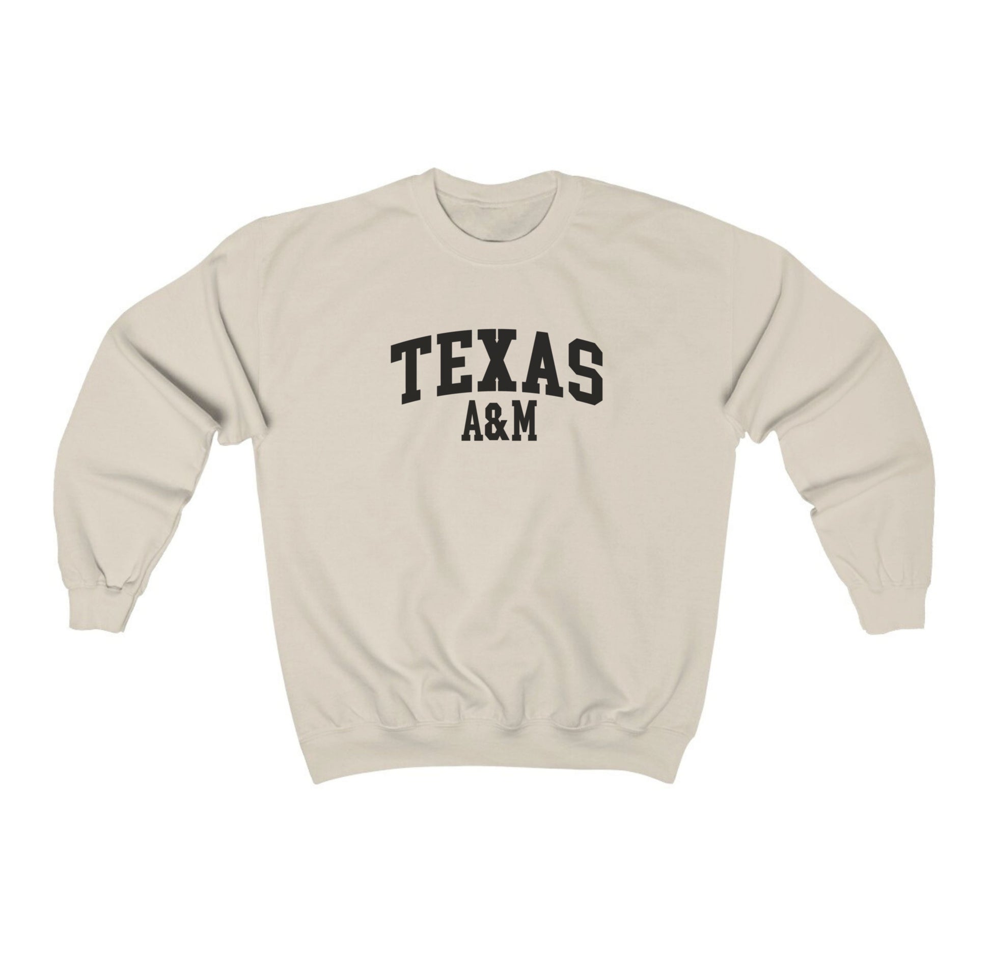 The Sand Adult Unisex Texas A&M Varsity Crewneck Sweatshirt lays flat on a white background. The ﻿Texas A&M Varsity﻿ graphic is in bold Black in a Collegiate style.