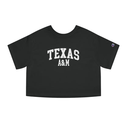 The Black Adult Womens Texas A&M Varsity Crop Top lays flat on a white background. The ﻿Texas A&M Varsity﻿ graphic is in bold White in a Collegiate style.