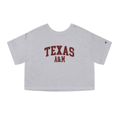 The Oxford Grey Adult Womens Texas A&M Varsity Crop Top lays flat on a white background. The ﻿Texas A&M Varsity﻿ graphic is in bold Maroon in a Collegiate style.