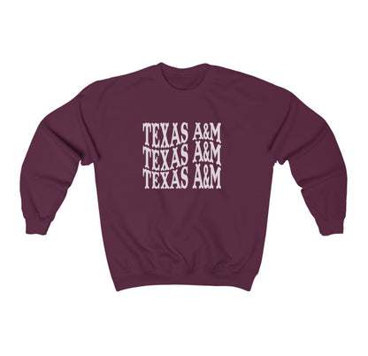 The Maroon Adult Unisex Texas A&M Western Crewneck Sweatshirt lays flat on a white background. The ﻿Texas A&M Western﻿ graphic is in bold White in a Western style.