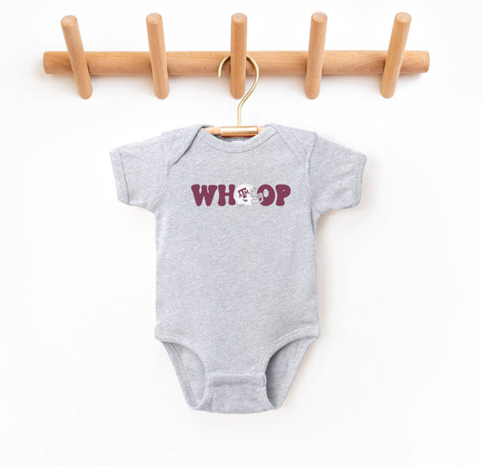 The Heather Grey Infant Unisex Texas A&M Retro Whoop Bodysuit lays flat on a white background. The ﻿Texas A&M Retro Whoop﻿ graphic is in bold Maroon in a Vintage style.