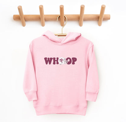 The Pink Toddler Unisex Texas A&M Retro Whoop Hooded Sweatshirt lays flat on a white background. The ﻿Texas A&M Retro Whoop﻿ graphic is in bold White in a Vintage style.