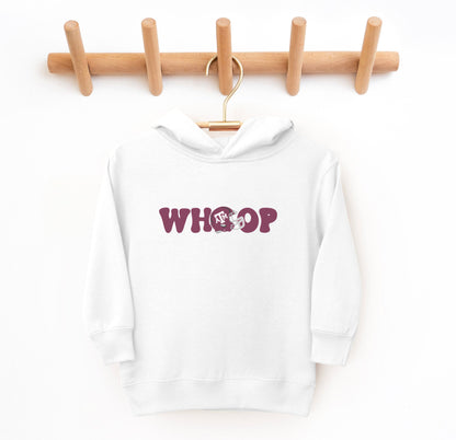 The White Toddler Unisex Texas A&M Retro Whoop Hooded Sweatshirt lays flat on a white background. The ﻿Texas A&M Retro Whoop﻿ graphic is in bold Maroon in a Vintage style.