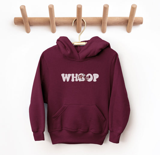 The Maroon Youth Unisex Texas A&M Retro Whoop Hooded Sweatshirt lays flat on a white background. The ﻿Texas A&M Retro Whoop﻿ graphic is in bold White in a Vintage style.