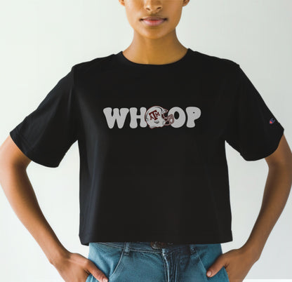 A model wears the Black Adult Womens Texas A&M Retro Whoop Crop Top.  The ﻿Texas A&M Retro Whoop﻿ graphic is in bold White in a Vintage style.