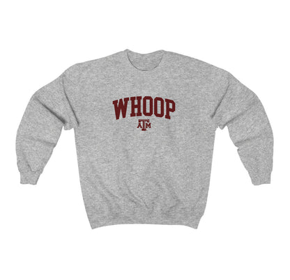 The Sport Grey Adult Unisex Texas A&M Whoop Collegiate Crewneck Sweatshirt lays flat on a white background. The ﻿Texas A&M Whoop Collegiate﻿ graphic is in bold Maroon in a Varsity style.