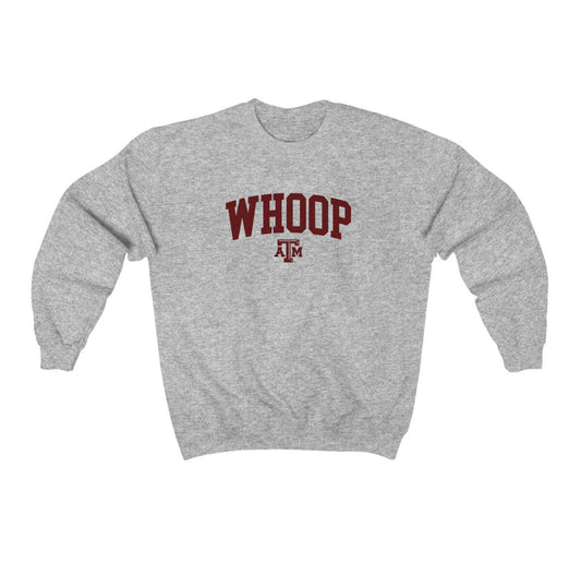 The Sport Grey Adult Unisex Texas A&M Whoop Collegiate Crewneck Sweatshirt lays flat on a white background. The ﻿Texas A&M Whoop Collegiate﻿ graphic is in bold Maroon in a Varsity style.