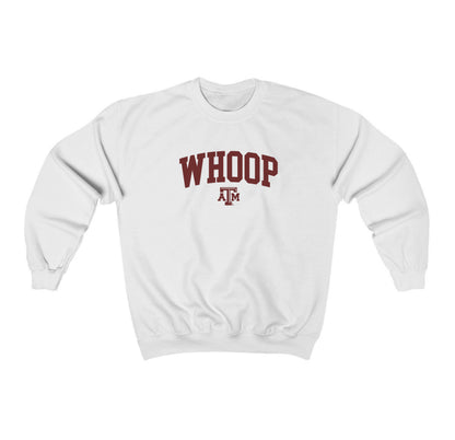 The White Adult Unisex Texas A&M Whoop Collegiate Crewneck Sweatshirt lays flat on a white background. The ﻿Texas A&M Whoop Collegiate﻿ graphic is in bold Maroon in a Varsity style.