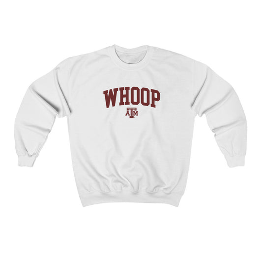 The White Adult Unisex Texas A&M Whoop Collegiate Crewneck Sweatshirt lays flat on a white background. The ﻿Texas A&M Whoop Collegiate﻿ graphic is in bold Maroon in a Varsity style.