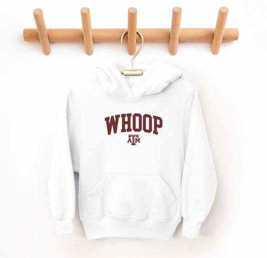 The White Youth Unisex Texas A&M Whoop Collegiate Hooded Sweatshirt lays flat on a white background. The ﻿Texas A&M Whoop Collegiate﻿ graphic is in bold Maroon in a Varsity style.