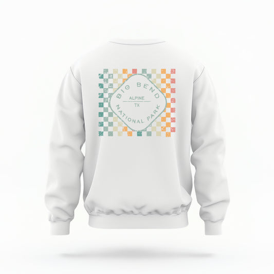 A model wears the White Big Bend Retro Typography Crewneck Sweatshirt.  The ﻿Big Bend Retro Typography﻿ graphic is in bold Multicolor in a Retro style.