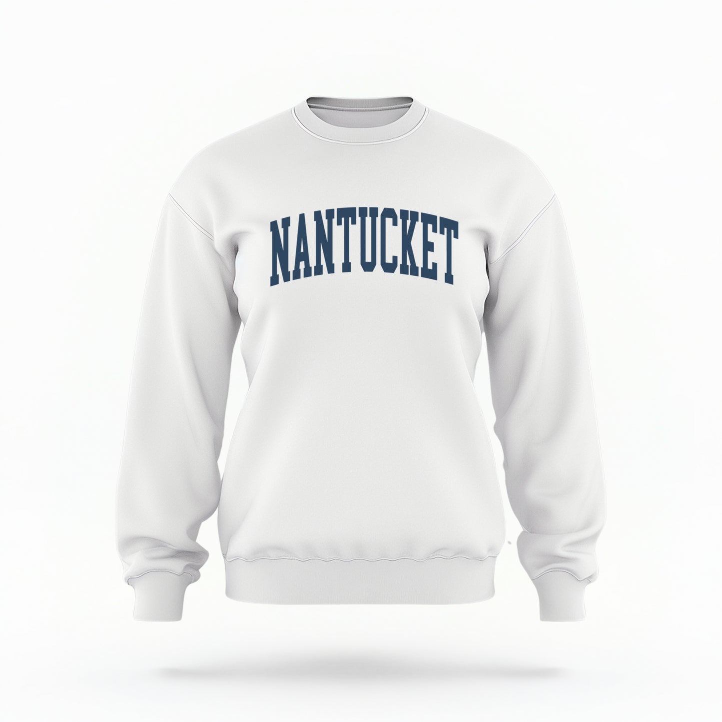 The white Unisex Nantucket Varsity Crewneck Sweatshirt lays flat on a white background. The Nantucket graphic is in bold navy and varsity offset style.