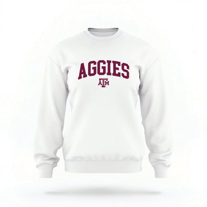 The White Unisex Texas A&M Aggies Collegiate Crewneck Sweatshirt lays flat on a white background. The ﻿Texas A&M Aggies Collegiate﻿ graphic is in bold Maroon in a Collegiate style.