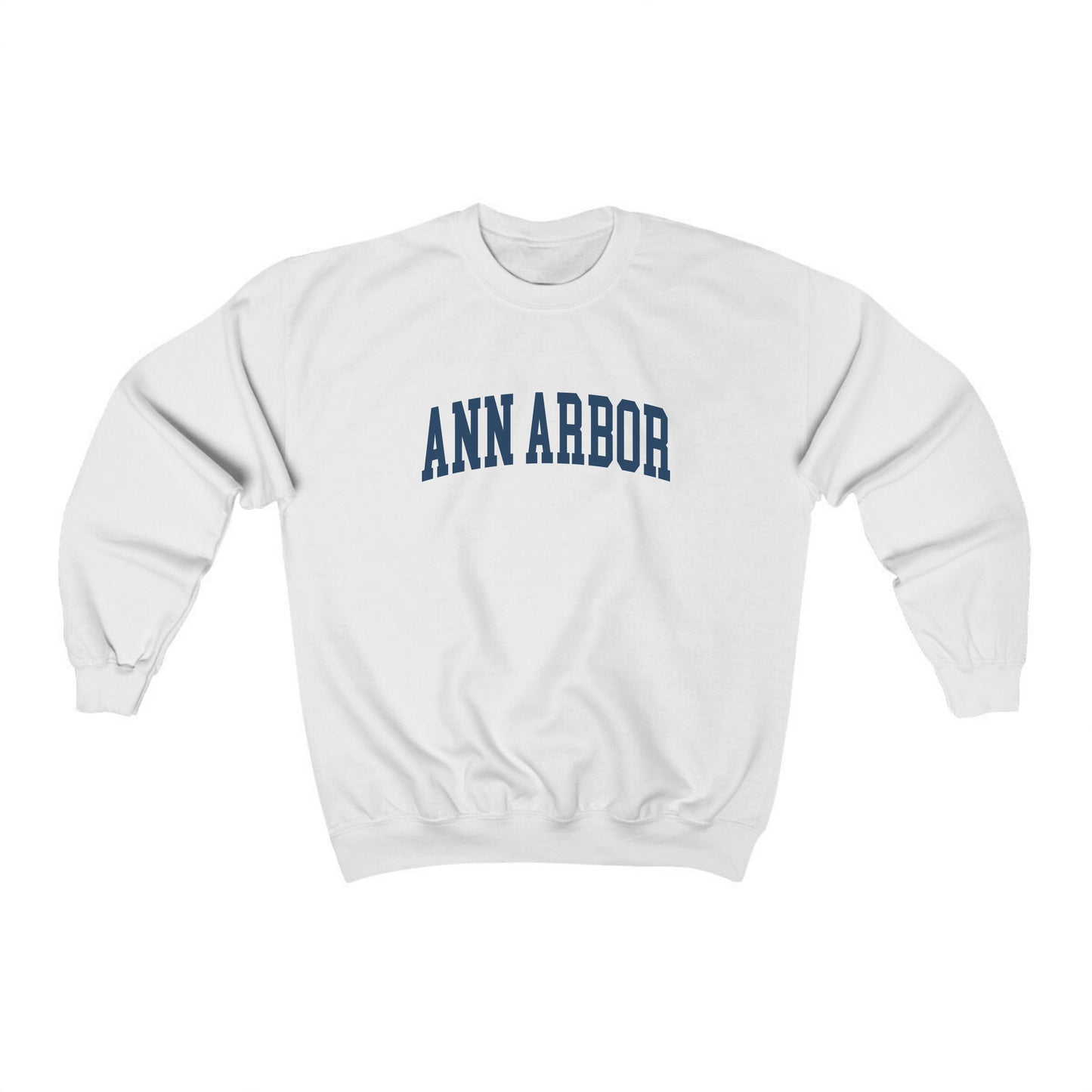 The White Adult Unisex Ann Arbor Michigan Varsity Crewneck Sweatshirt lays flat on a white background. The Ann Arbor Michigan Varsity graphic is in bold Navy in a Collegiate style.