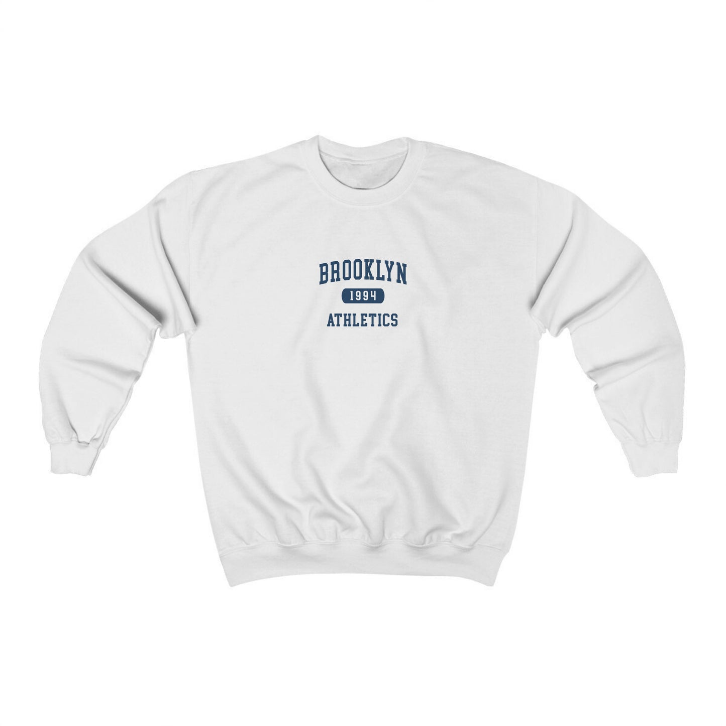 The White Brooklyn Athletics Crewneck Sweatshirt lays flat on a white background. The ﻿Brooklyn Athletics﻿ graphic is in bold Navy in a Varsity style.