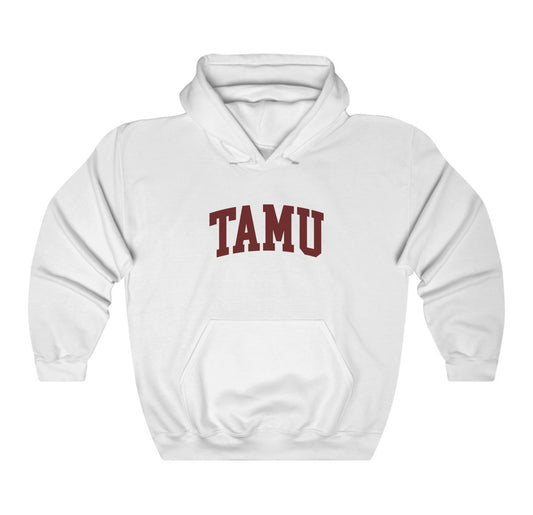 The White Adult Unisex Texas A&M TAMU Hooded Sweatshirt lays flat on a white background. The ﻿Texas A&M TAMU﻿ graphic is in bold Maroon in a Collegiate style.