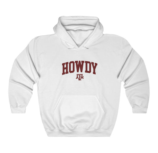 The White Adult Unisex Texas A&M Howdy Varsity Hooded Sweatshirt lays flat on a white background. The ﻿Texas A&M Howdy Varsity﻿ graphic is in bold Maroon in a Collegiate style.