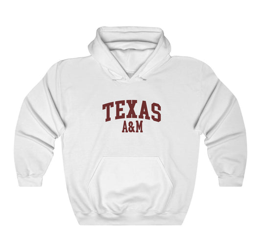 The White Adult Unisex Texas A&M Varsity Hooded Sweatshirt lays flat on a white background. The ﻿Texas A&M Varsity﻿ graphic is in bold Maroon in a Collegiate style.