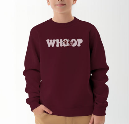 A model wears the Maroon Youth Unisex Texas A&M Retro Whoop Crewneck Sweatshirt.  The ﻿Texas A&M Retro Whoop﻿ graphic is in bold White in a Vintage style.