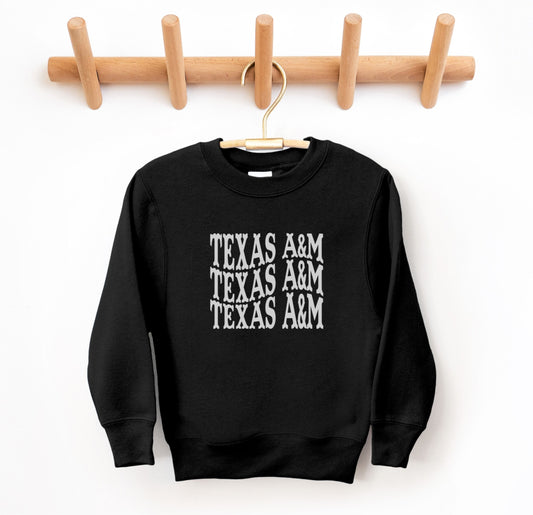 The Black Youth Unisex Texas A&M Western Crewneck Sweatshirt lays flat on a white background. The ﻿Texas A&M Western﻿ graphic is in bold White in a Western style.