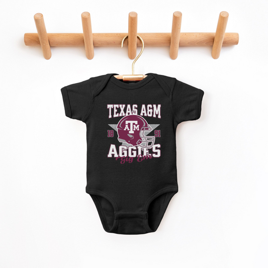 The Black Texas A&M Aggies Football Bodysuit lays flat on a white background. The ﻿Texas A&M Aggies Football﻿ graphic is in bold Multicolor in a Varsity style.