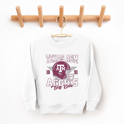 The White Texas A&M Aggies Football Crewneck Sweatshirt lays flat on a white background. The ﻿Texas A&M Aggies Football﻿ graphic is in bold Multicolor in a Varsity style.