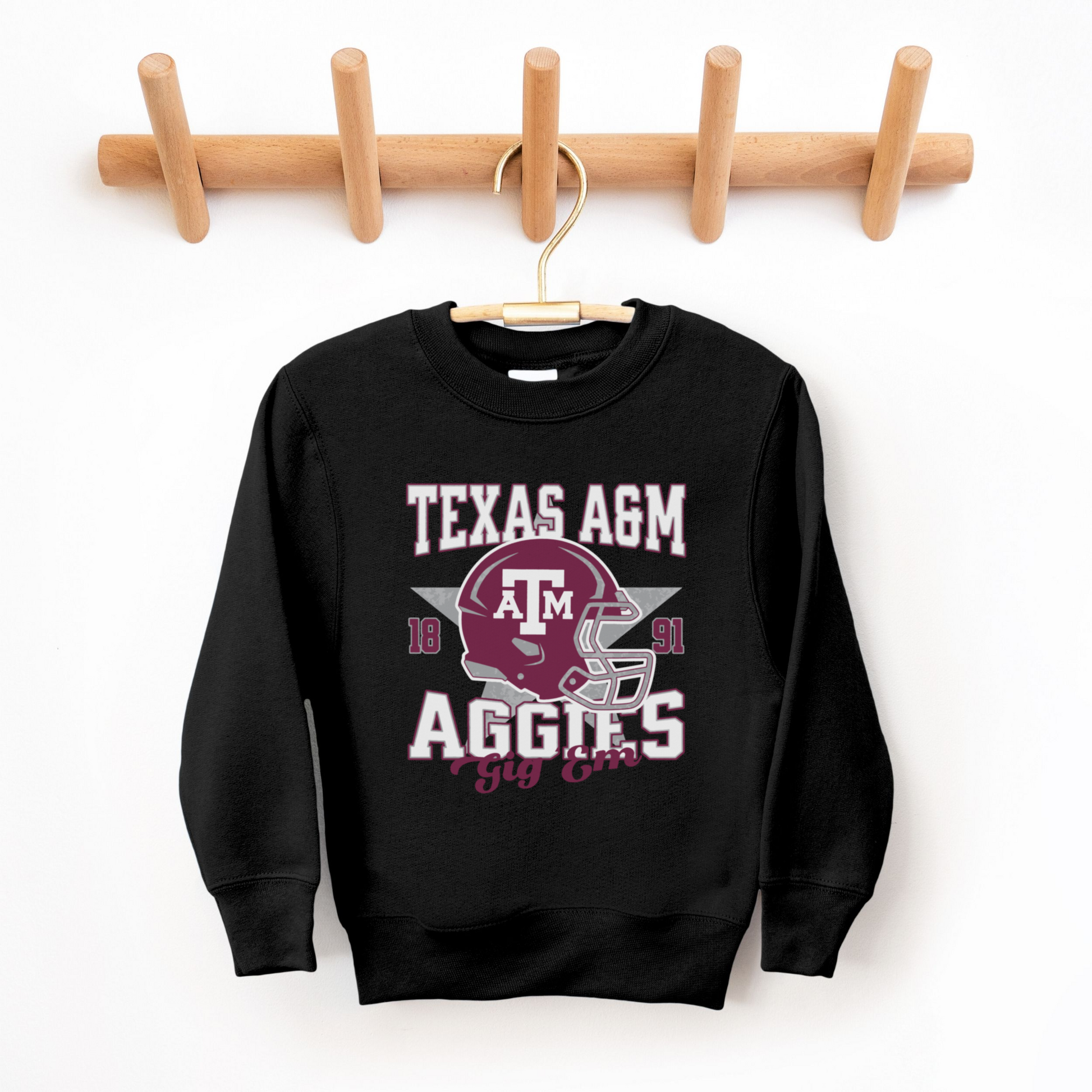 The Black Texas A&M Aggies Football Crewneck Sweatshirt lays flat on a white background. The ﻿Texas A&M Aggies Football﻿ graphic is in bold Multicolor in a Varsity style.