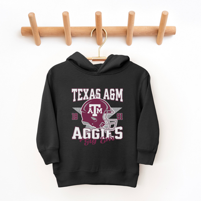 The Black Texas A&M Aggies Football Hooded Sweatshirt lays flat on a white background. The ﻿Texas A&M Aggies Football﻿ graphic is in bold Multicolor in a Varsity style.